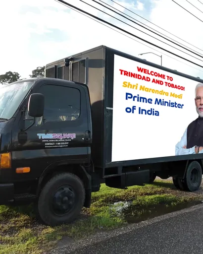 Timesquare LED truck on a roadside verge showing a Welcome to Trinidad and Tobago message for India's Prime Minister